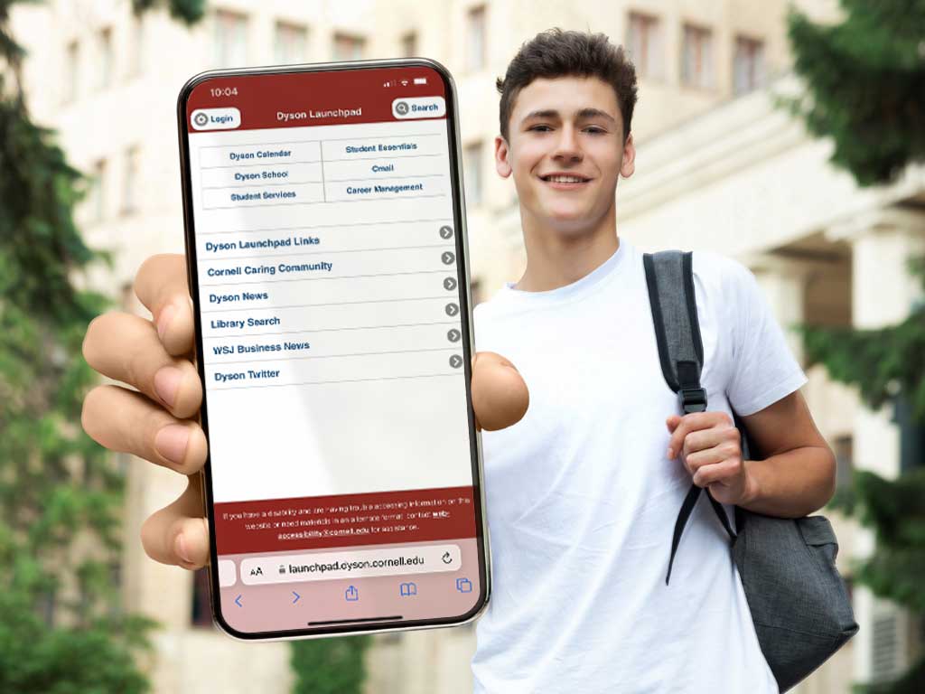 Student with a backpack on one shoulder showing Dyson Launchpad on his cellphone.