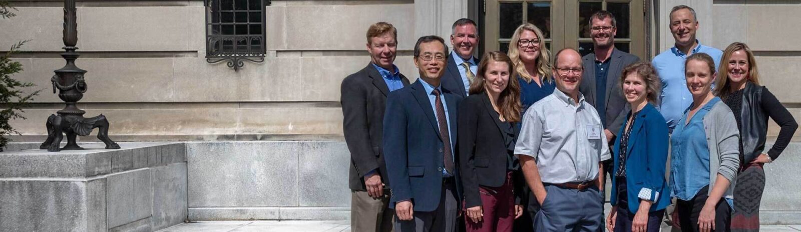 Agribusiness Advisory Council members stand outside Warren Hall.