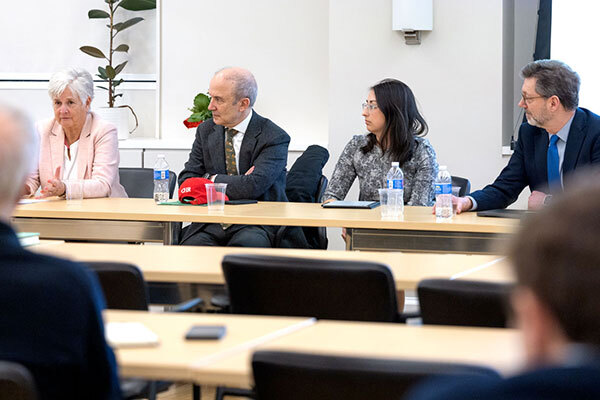 A panel of faculty members.